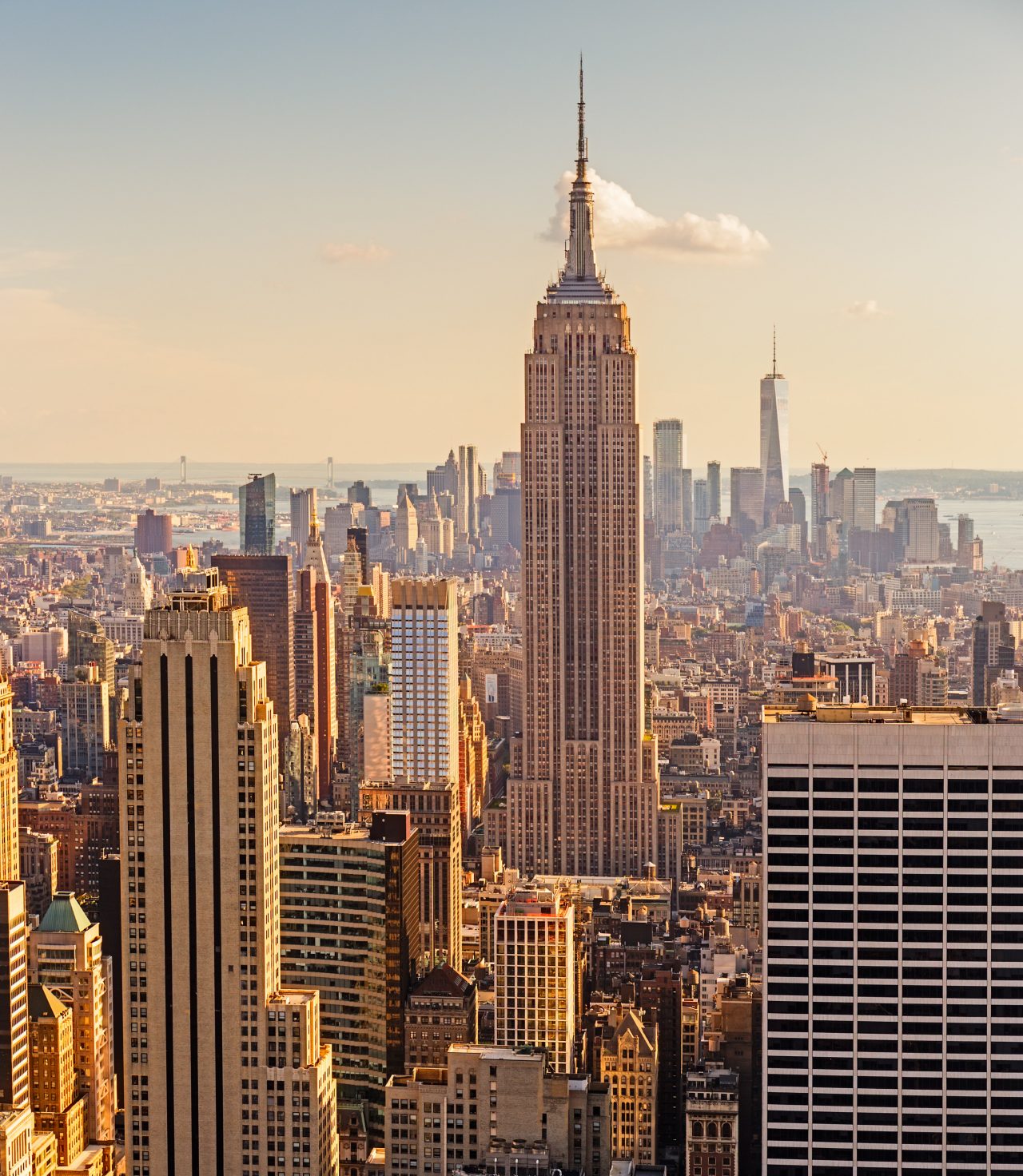 Manhattan Midtown Skyline with illuminated skyscrapers at sunset. NYC, USA